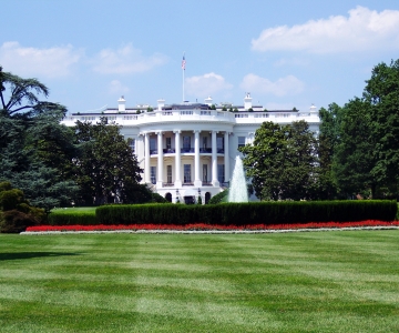 Photo of the front the White House with the lawn