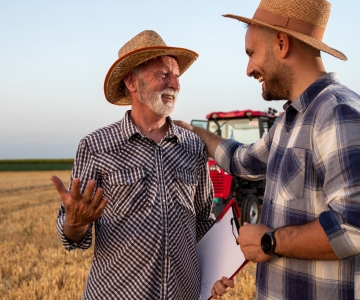 Farmers happy and smiling in a field