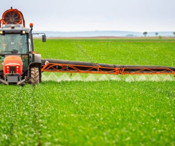 farmer spraying field