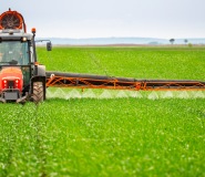 farmer spraying field