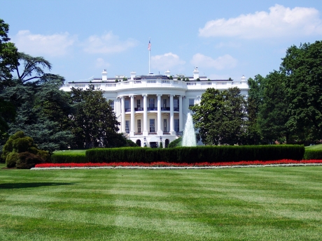 Photo of the front the White House with the lawn