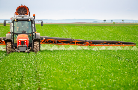 farmer spraying field